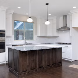 The Jamestown style kitchen is crafted with Maple wood with a white finish. The island is maple wood with a kodiak finish. Cabinets crafted in Michigan since 1958.