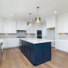 The New Shaker kitchen is crafted with Maple wood with a white finish. The island is maple wood with a custom paint finish. Call 586-247-1140 or visit our showrooms in Shelby Township and West Bloomfield to find out more information.