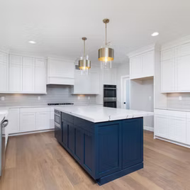 The New Shaker kitchen is crafted with Maple wood with a white finish. The island is maple wood with a custom paint finish. Call 586-247-1140 or visit our showrooms in Shelby Township and West Bloomfield to find out more information.