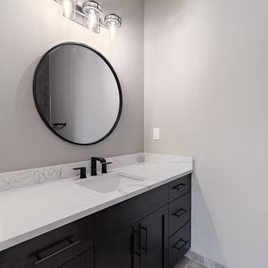 The New Shaker bathroom from Lafata Cabinets uses maple wood with a java finish. Cabinets crafted in Michigan since 1958.