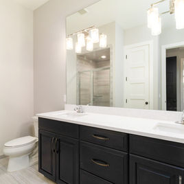 

The Jamestown II Bathroom from LaFata Cabinets uses maple wood with a graphite finish. Cabinets crafted in Michigan since 1958.