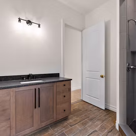 The New Shaker bathroom from Lafata Cabinets uses maple wood with a sable finish. Cabinets crafted in Michigan since 1958.