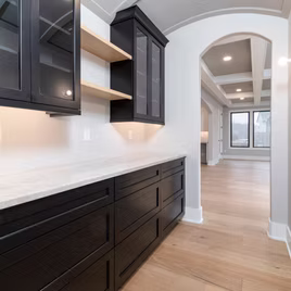 The Brookhaven II Bar from Lafata Cabinets uses maple wood with a black paint. Cabinets crafted in Michigan since 1958.