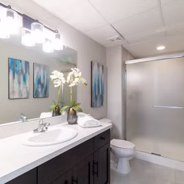 The New Shaker Bathroom from Lafata Cabinets uses maple wood with a rye finish. Cabinets crafted in Michigan since 1958.