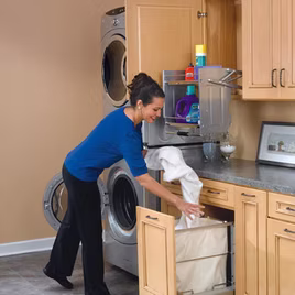 This pullout drawer organizer can be used in any bedroom or laundry room. The hamper pulls out as a canvas bag. It gives a clean look, while being convenient and saving space.
