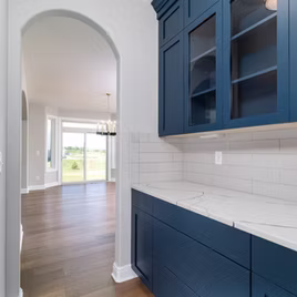 The New Shaker bar from Lafata Cabinets uses maple wood with a custom paint finish. Cabinets crafted in Michigan since 1958.