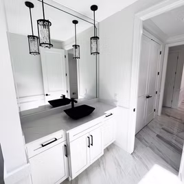 The New Shaker bathroom from Lafata Cabinets uses maple wood with a white finish. Cabinets crafted in Michigan since 1958.