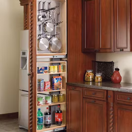 This pullout organizer is one of the most deceiving and convenient. The pull-out is attached to a filler. When closed, appears as just a decorative piece. There are two sections to this organizer. A top section featuring pegs, and a bottom section with basic shelving.