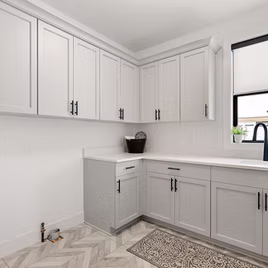 The Youngstown Sq Edge Laundry Room from Lafata Cabinets uses maple wood with a custom finish. Cabinets crafted in Michigan since 1958.