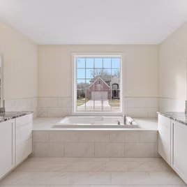 The New Shaker bathroom from Lafata Cabinets uses maple wood with a white finish. Cabinets crafted in Michigan since 1958.