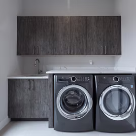The Midwest Laundry Room from Lafata Cabinets uses tafisa with a custom paint. Cabinets crafted in Michigan since 1958.