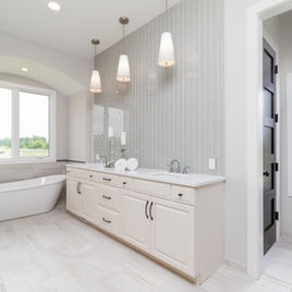The Jamestown Bathroom from Lafata Cabinets uses maple wood with a cream finish. Cabinets crafted in Michigan since 1958.