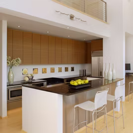 The Midwest Kitchen from LaFata Cabinets is crafted with zebrawood and stainless steel. Cabinets crafted in Michigan since 1958.