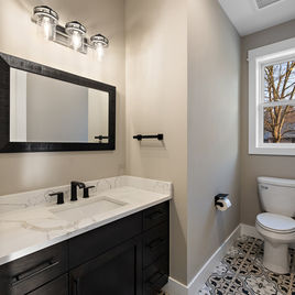 The New Shaker bathroom from Lafata Cabinets uses maple wood with a java finish. Cabinets crafted in Michigan since 1958.