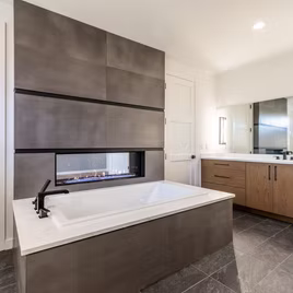 The Midwest bathroom from Lafata Cabinets uses white oak wood with a custom finish. Cabinets crafted in Michigan since 1958.